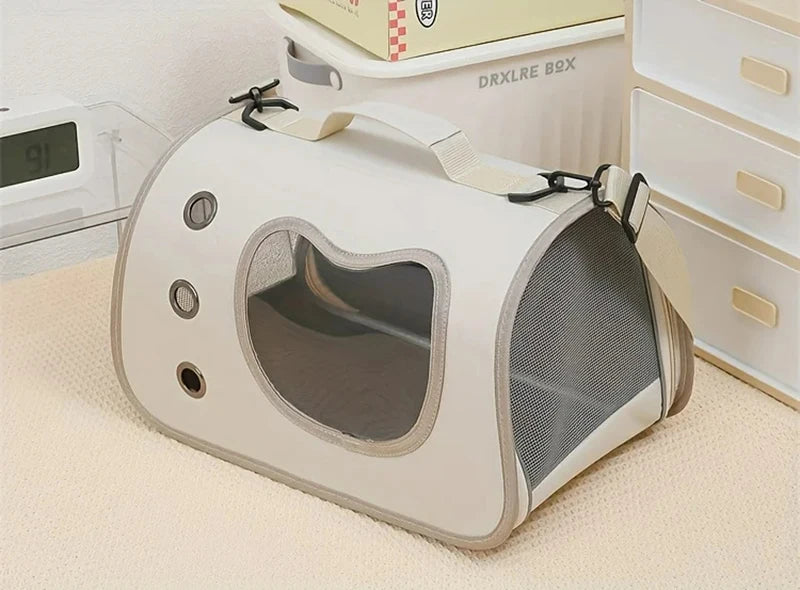 The KittyNook Cat Co. Portable Pet Carrier Bag features mesh sides and a clear window for comfy, on-the-go pet travel.
