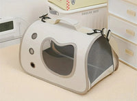 Thumbnail for The KittyNook Cat Co. Portable Pet Carrier Bag features mesh sides and a clear window for comfy, on-the-go pet travel.