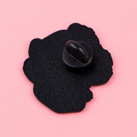 Thumbnail for The Cat at Work Enamel Brooch Pin by KittyNook Cat Co., with a black rubber clutch, on a pink surface.