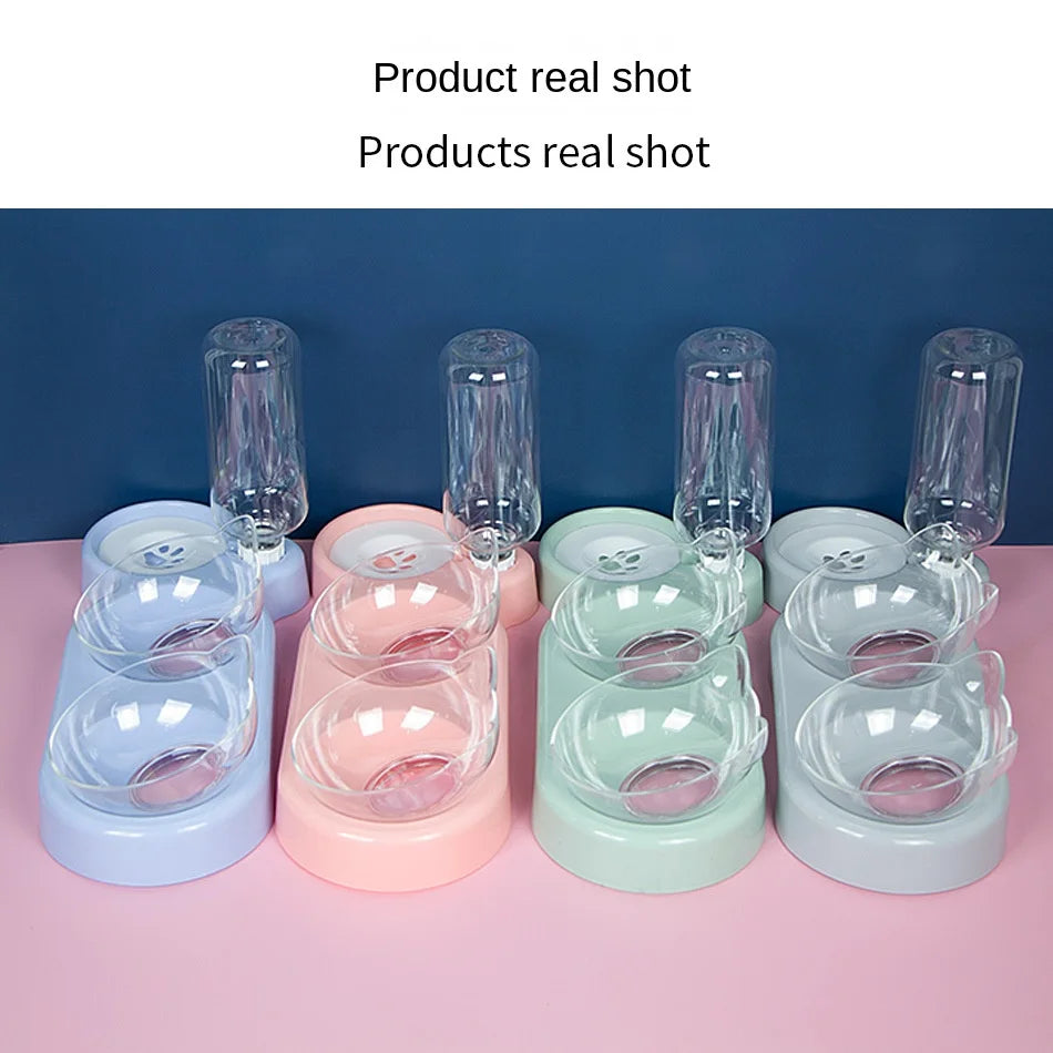 Four KittyNook Cat Co. Automatic Water Renewal Cat Bowls with filters, in pastel colors, on a pink surface.