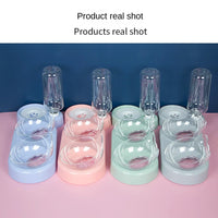 Thumbnail for Four KittyNook Cat Co. Automatic Water Renewal Cat Bowls with filters, in pastel colors, on a pink surface.