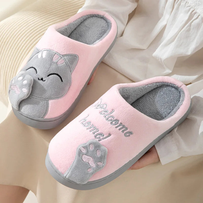 KittyNook Cat Co. Happy Pawprints Lucky Cat Slippers—pink, cozy, and cushioned with “Welcome home!” embroidery.