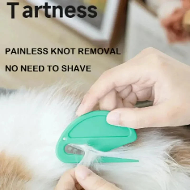 Hand using KittyNook Cat Co. 2-in-1 Pet Knot Remover Grooming Comb, text: “painless knot removal.”.