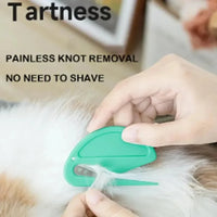 Thumbnail for Hand using KittyNook Cat Co. 2-in-1 Pet Knot Remover Grooming Comb, text: “painless knot removal.”.