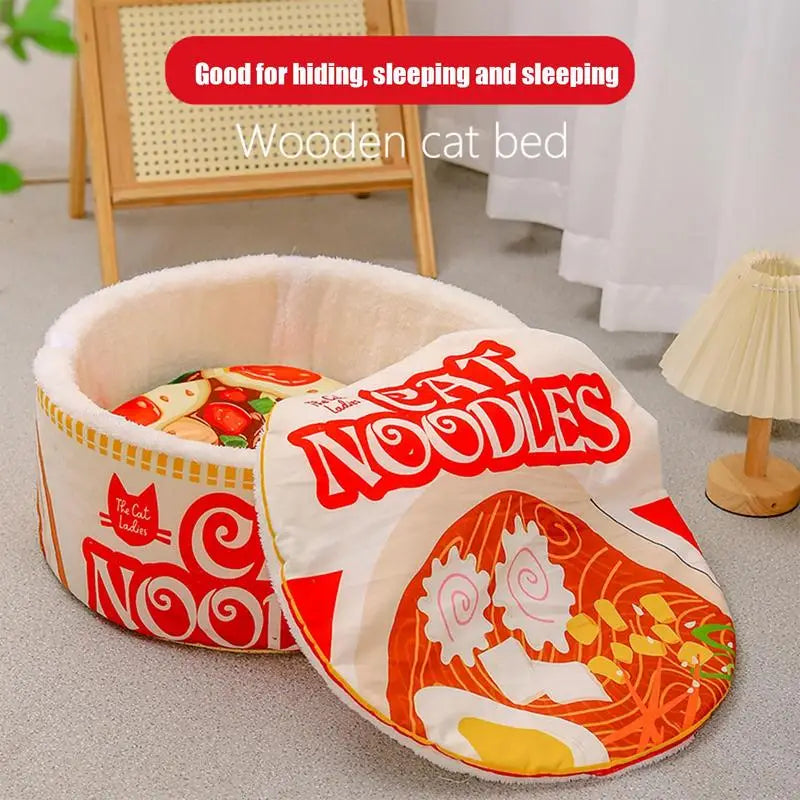 The Cute Ramen Cat Bed by KittyNook Cat Co. has orthopedic support and a removable noodle-printed lid.