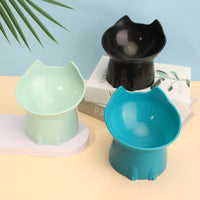 Thumbnail for Three KittyNook Cat Co. Orthopedic Raised Cat Feeders in black, mint green, and teal sit near books and a plant leaf.