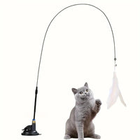 Thumbnail for Gray cat plays with KittyNook Cat Co. Ultimate Cat Teaser Toy—feather wand & bell, suction base, on white background.