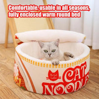 Thumbnail for A gray cat lounges in the Cute Ramen Cat Bed from KittyNook Cat Co., combining comfort with playful ramen-bowl style.
