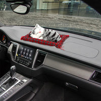 Thumbnail for KittyNook Cat Co.’s Sleepy Kitten Plush Decoration naps on a plaid pillow—cute for your car dashboard and city drives.