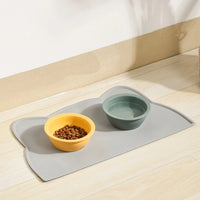 Thumbnail for KittyNook Cat Co. Silicone Pet Feeding Bowls—yellow for kibble, green for water—on a hypoallergenic mat.