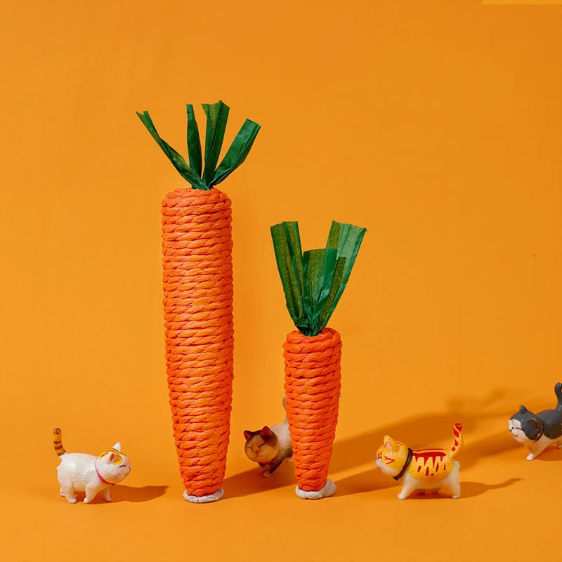 Two toy carrots, four cat figurines, and a KittyNook Cat Co. Bite-Resistant Cat Toy on an orange background.