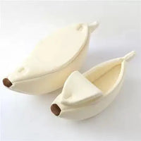 Thumbnail for Two cream-colored KittyNook Cat Co. Cute Funny Banana Shape Cat Beds with brown tips on a white surface.
