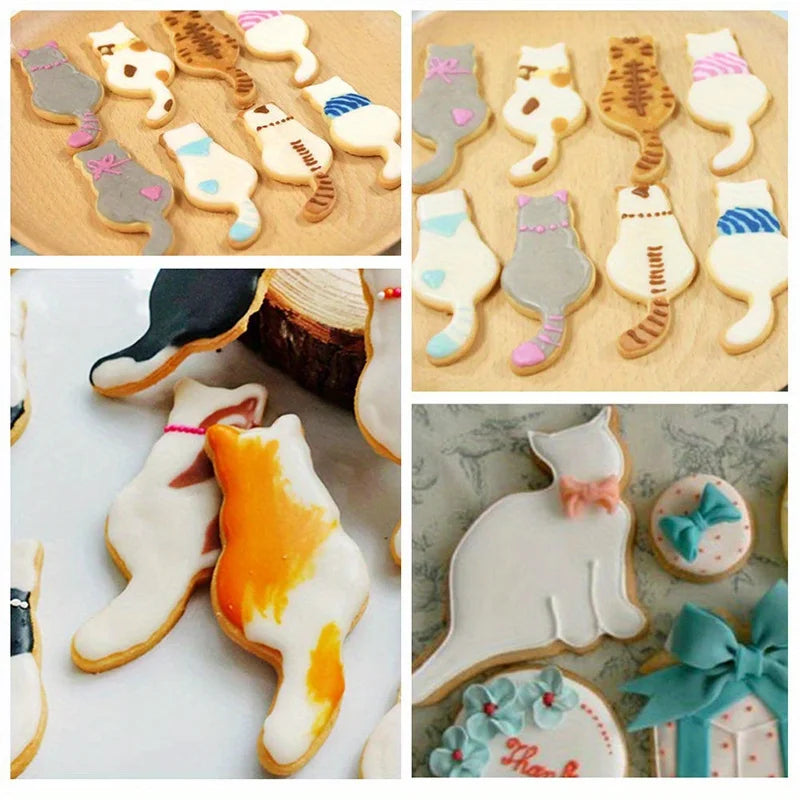 Cat cookies made with KittyNook Cat Co.'s Cat Shape Cookie Cutter Set, decorated on wooden boards with bows.