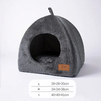 Thumbnail for KittyNook Cat Co. Cozy Triangle Cat Cave Bed: gray, tent-shaped, round entrance; sizes S, M, L.