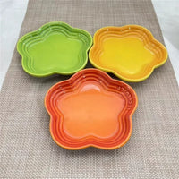 Thumbnail for Three KittyNook Cat Co. Extra Wide Raised Flower Cat Bowls sit on a beige textured mat.
