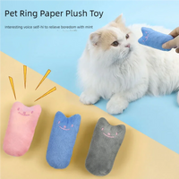 Thumbnail for A fluffy white cat eyes KittyNook Cat Co.'s Safe Catnip Chew Toy—pick pink, blue, or gray to ease your cat's boredom.