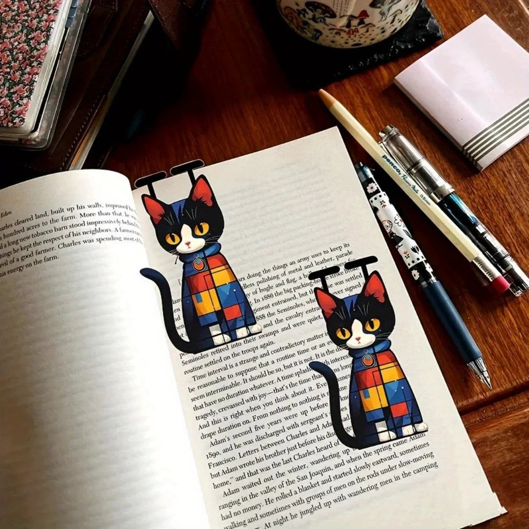 Two flat cat bookmarks from the Sleek Flat Cat Acrylic Set by KittyNook Cat Co. add charm to any book.