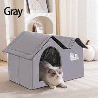 Thumbnail for A gray cat lounges in the KittyNook Cat Co. Portable Pet Cooling House, enjoying indoor comfort on a light carpet.