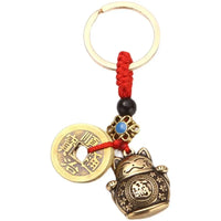 Thumbnail for KittyNook Cat Co.’s Lucky Paws Fortune Cat Keychain adds charm and luck to your keys with a gold coin and red cord.