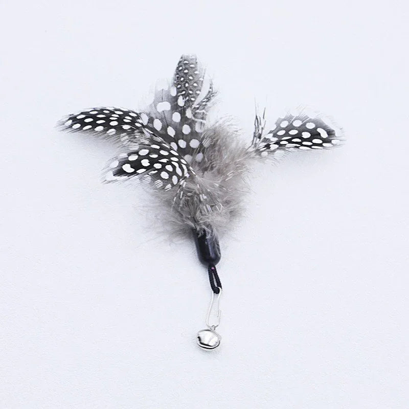 KittyNook Cat Co.'s Eco-Friendly Wood & Feather Cat Teaser with bell clip, shown on a white background.