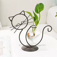 Thumbnail for KittyNook Cat Co.: Modern Cat Iron Hydroponic Decor—a wire cat stand with glass vase for stylish plant displays.