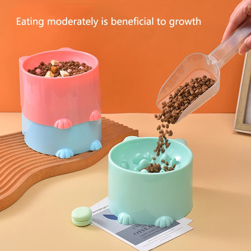 KittyNook Cat Co.’s Elevated Anti-Choke Slow Feeder Bowl: two paw-shaped bowls and a quote on eating moderately.