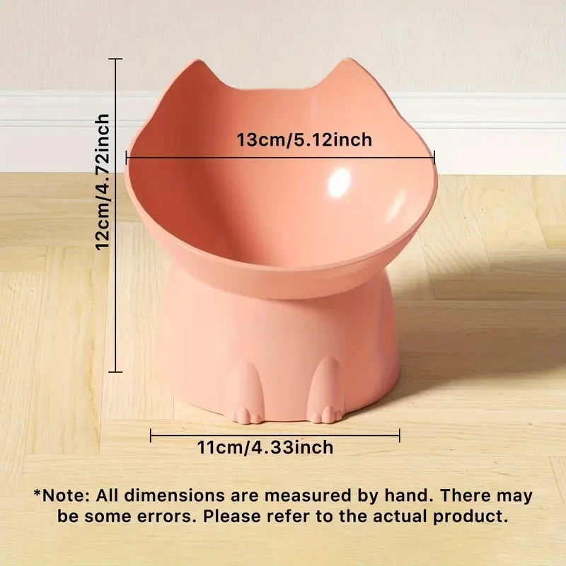 KittyNook Cat Co. Orthopedic Raised Cat Feeder, pink cat-shaped, 13cm wide, 12cm tall, 11cm base, on wood floor.