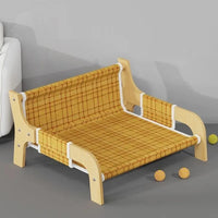 Thumbnail for KittyNook Cat Co. Cat Summer Sofa Bed with yellow plaid seat, beside three yellow balls on a gray floor.