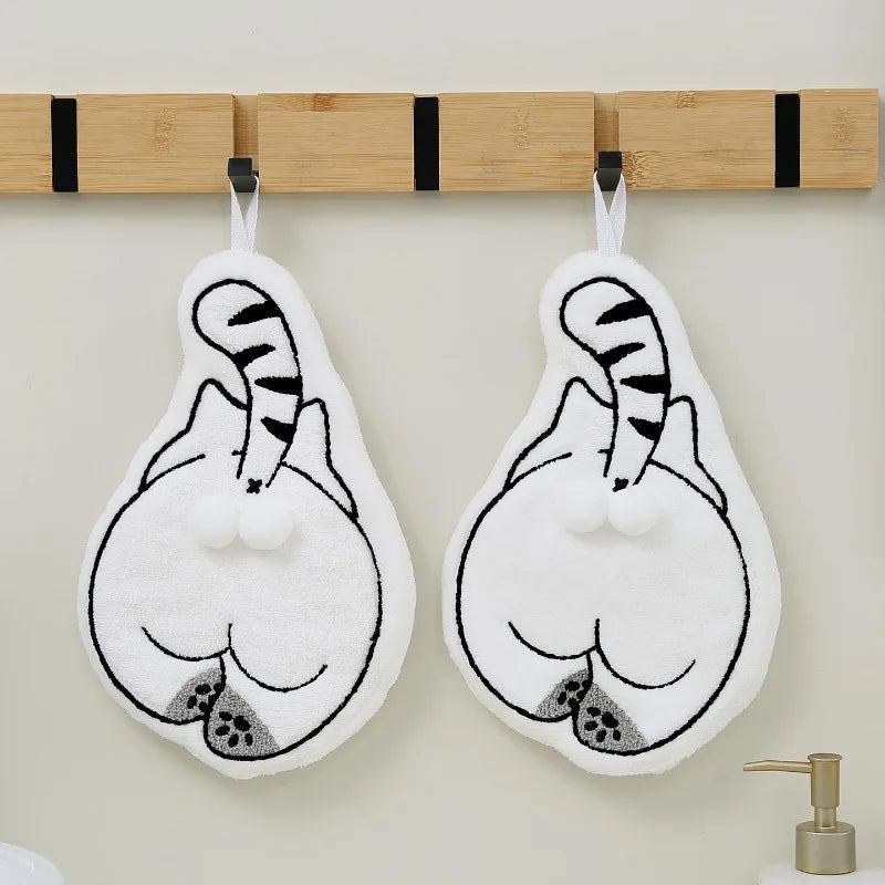 Two white Cartoon Cat Hanging Hand Towels shaped like cartoon cats, hanging from a wooden wall rack.