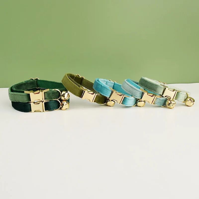 KittyNook Cat Co. Velvet Cat Collars in green and blue have gold buckles, bells, and luxurious softness for your feline.