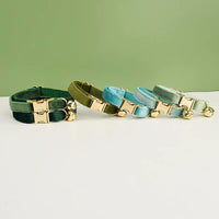 Thumbnail for KittyNook Cat Co. Velvet Cat Collars in green and blue have gold buckles, bells, and luxurious softness for your feline.
