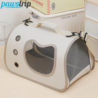 Thumbnail for KittyNook Cat Co. Portable Pet Carrier Bag in beige with mesh sides, handle, and window, shown on a light carpet.