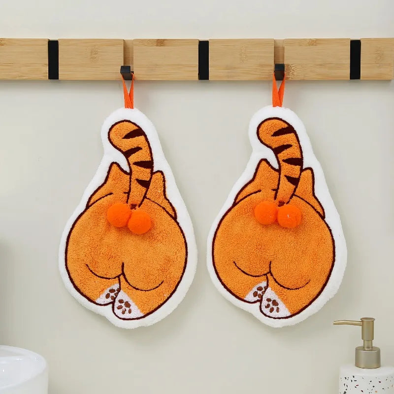 Two cute Cartoon Cat Hanging Hand Towels made of coral fleece hanging from a wooden rack.