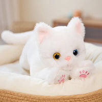 Thumbnail for The Snuggle Soft Cat Plush Doll by KittyNook Cat Co. has odd eyes, pink paw pads, and a soft cream body.