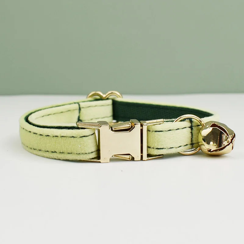 KittyNook Cat Co. Velvet Cat Collar in light green with gold buckle and bell, shown on white for a perfect fit and soft feel.
