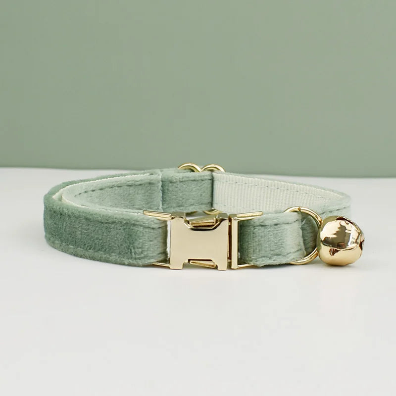KittyNook Cat Co. Velvet Cat Collar in light green with gold buckle and bell, offering luxurious softness and comfort.