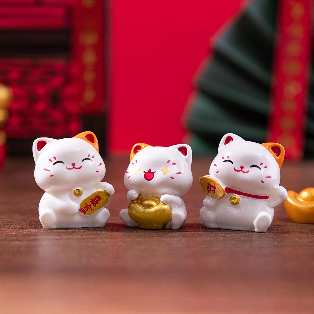 Three KittyNook Cat Co. Chinese Cartoon Fortune Cat Ornaments with gold accents make a meaningful, charming gift.