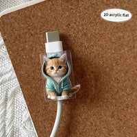 Thumbnail for A MeowGuard Cat Cable Protector by KittyNook Cat Co. sits on a cork surface, guarding a USB charger.