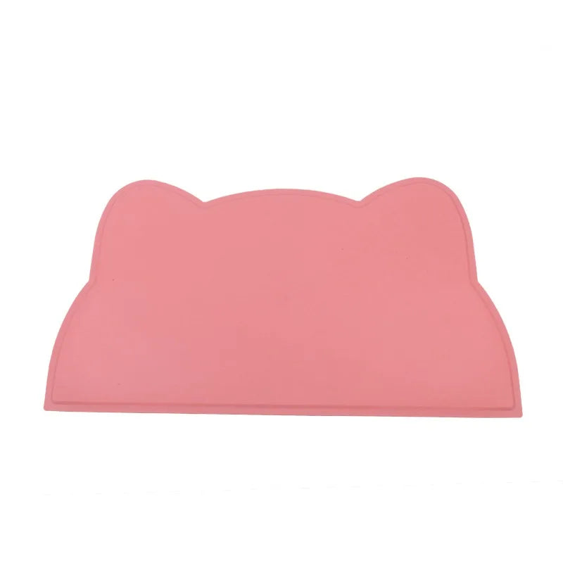KittyNook Cat Co.'s Silicone Pet Feeding Bowl is a pink, cat head-shaped mat with two ear-like bumps at the top.