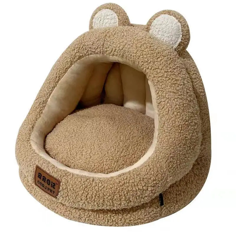 KittyNook Cat Co.'s Ultra Soft Cat Nest: a brown, plush bear-shaped cat bed with round ears and a cozy cave entrance.