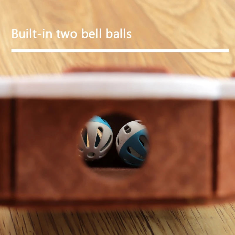 Close-up of The Ultimate Puzzle Box Toy by KittyNook Cat Co. with two built-in plastic bell balls shown inside.