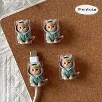 Thumbnail for Four KittyNook Cat Co. MeowGuard Cat Cable Protectors in teal hoodies, one guarding a charging cable on corkboard.