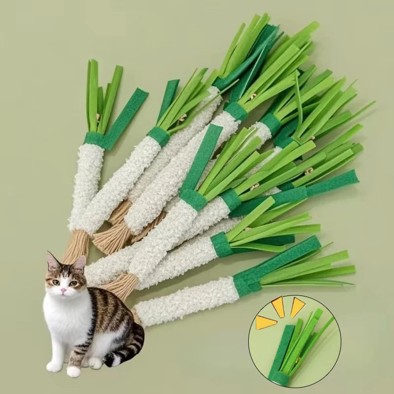 A cat sits near The Ultimate Kitten Teething Wand Toy by KittyNook Cat Co., with a close-up of one toy in the corner.