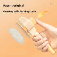 Thumbnail for Pressing the KittyNook Cat Co. Long Hair Cat Grooming Comb releases fur—ideal for easy cleaning and cat grooming.