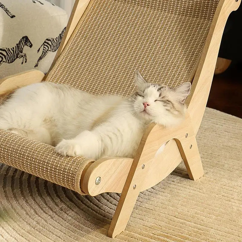 A fluffy white cat naps on the KittyNook Cat Co. Cat Sisal Wooden Chair, a modern lounge with a scratch-resistant seat.