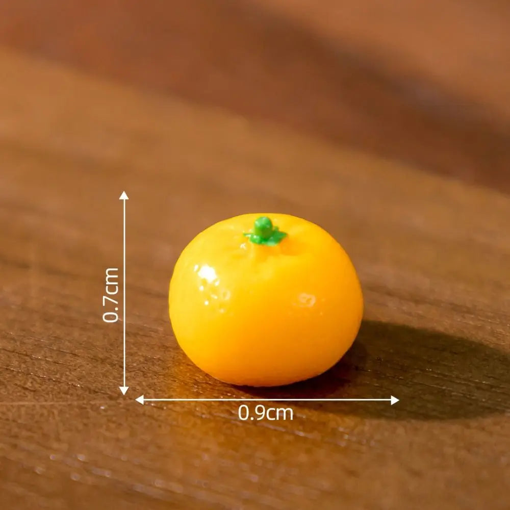The Creative Cat Doll Car Ornament by KittyNook Cat Co. features a 0.7 cm orange mandarin beside a resin cat figurine.
