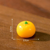 Thumbnail for The Creative Cat Doll Car Ornament by KittyNook Cat Co. features a 0.7 cm orange mandarin beside a resin cat figurine.