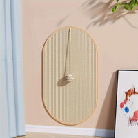 Thumbnail for KittyNook Cat Co.'s Durable Sisal Cat Scratch Pads feature a striped ball, cat art, and a plant on a beige wall.