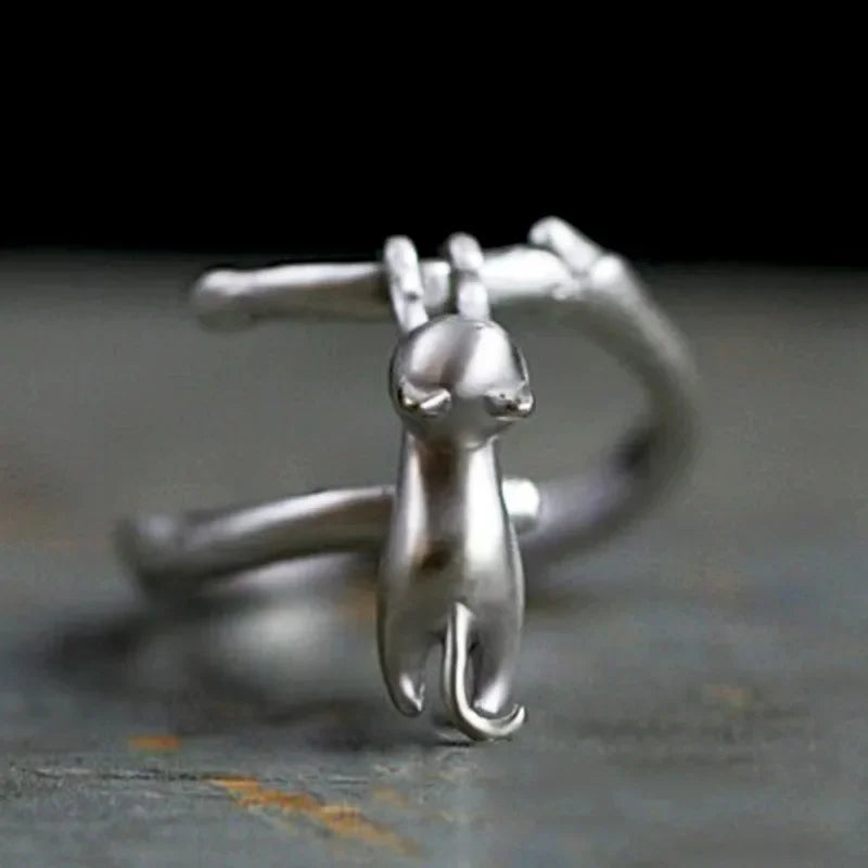 KittyNook Cat Co. Sterling Silver Cat Branch Ring—adjustable, with a cat hanging and its tail wrapped around the band.