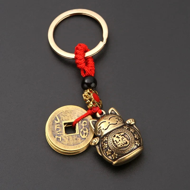 KittyNook Cat Co.'s Lucky Paws Fortune Cat Keychain brings luck and style to your keys.